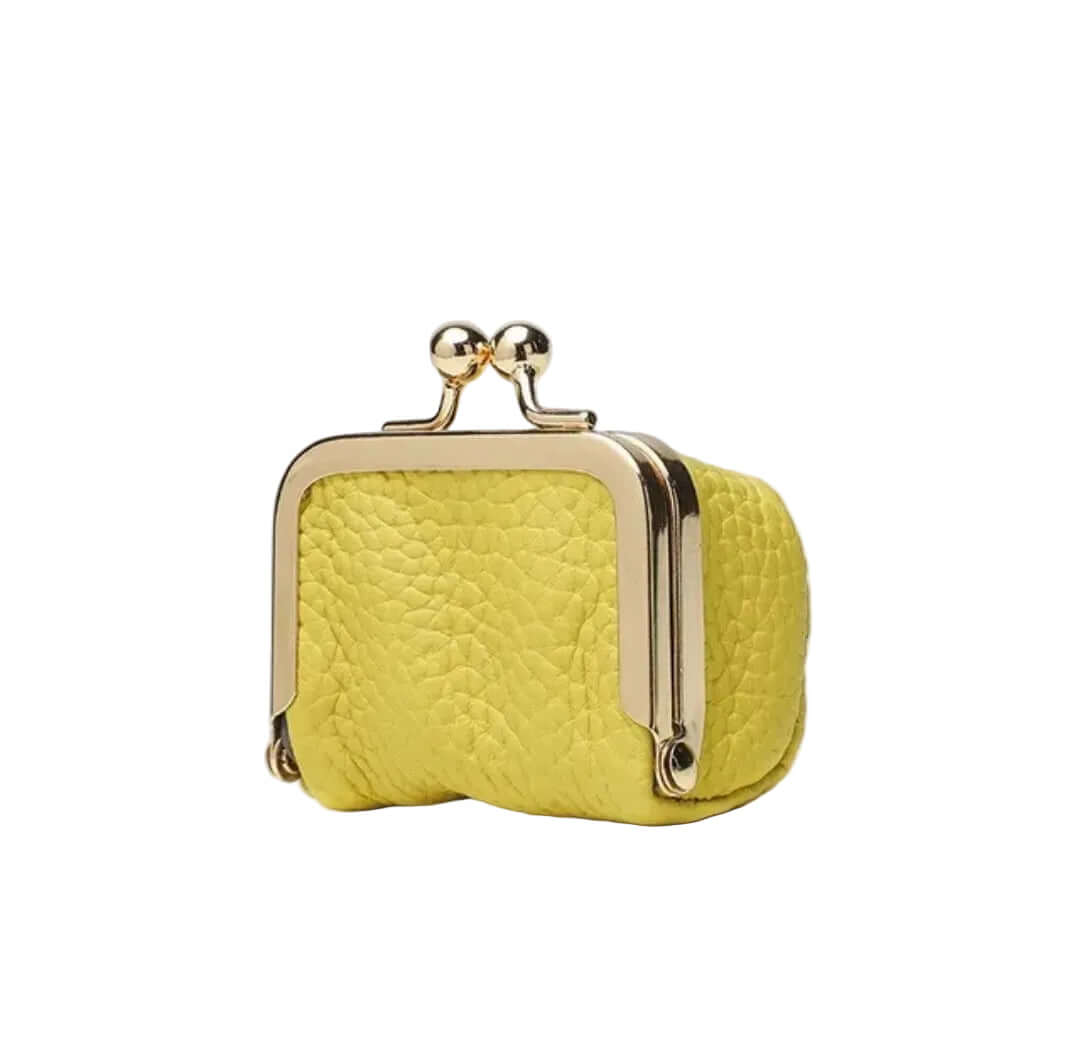 Yellow clutch bag with gold frame on a white background