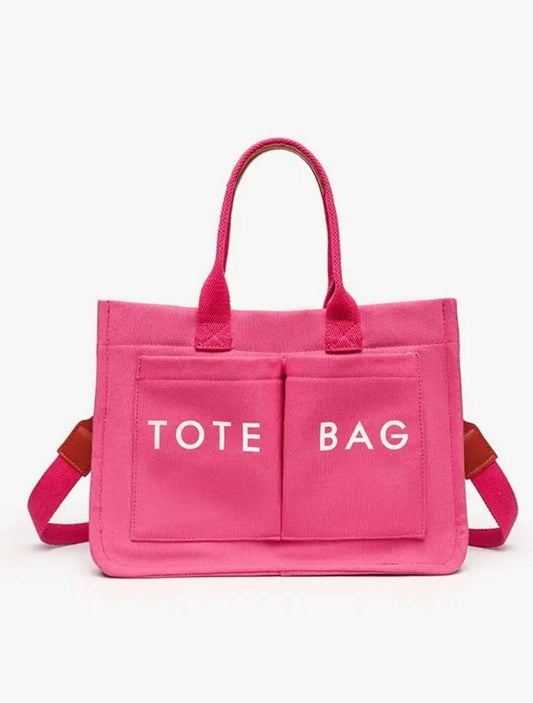 Pink tote bag with 'TOTE BAG' text on a white background