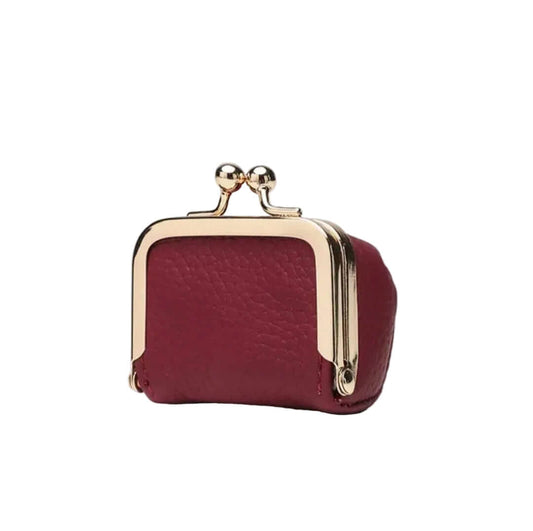 Dark red purse with gold accents on a white background