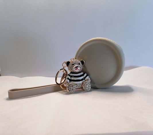 Nwamaka set by GrinSquid — round silicone coin purse with Ebele crystal teddy bear charm in striped enamel outfit