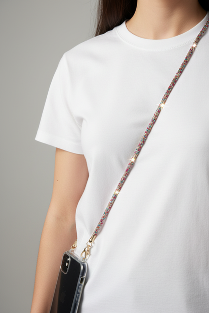Amara rainbow crystal phone chain worn crossbody over a white t-shirt