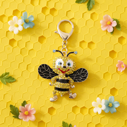A rhinestone bumble bee charm with enamel wings
