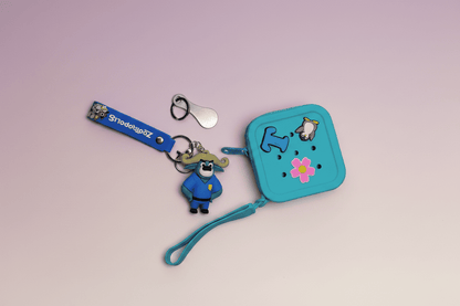 Blue keychain with cartoon character and pouch on a light pink background
