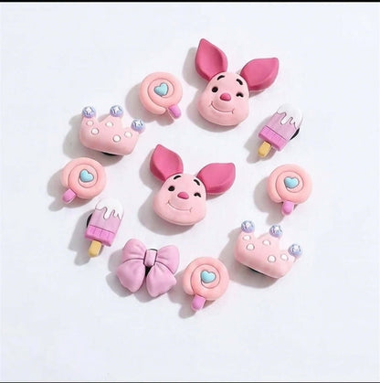 Set of pink cartoon character-themed products on a white background