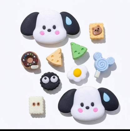Collection of cute, cartoon-like dog-shaped erasers on a white background
