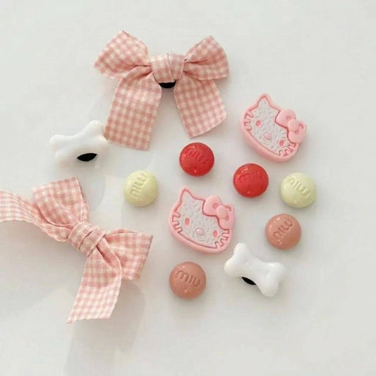 Kawaii-themed items including bows and character-shaped candies on a light background