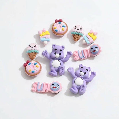 Set of colorful cartoon character charms on a light background