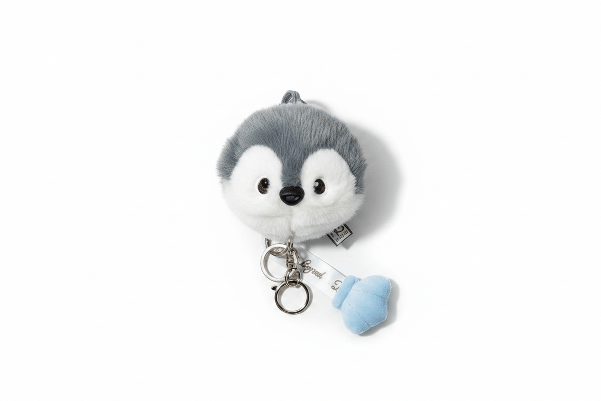 Nneka grey penguin plush coin purse with blue mitten charm