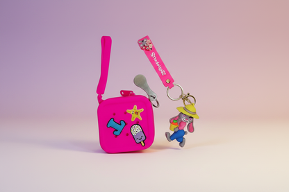 Pink pouch with colorful designs and a keychain on a gradient background