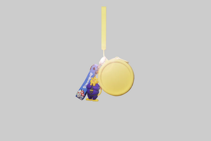 Yellow button with a strap on a light gray background