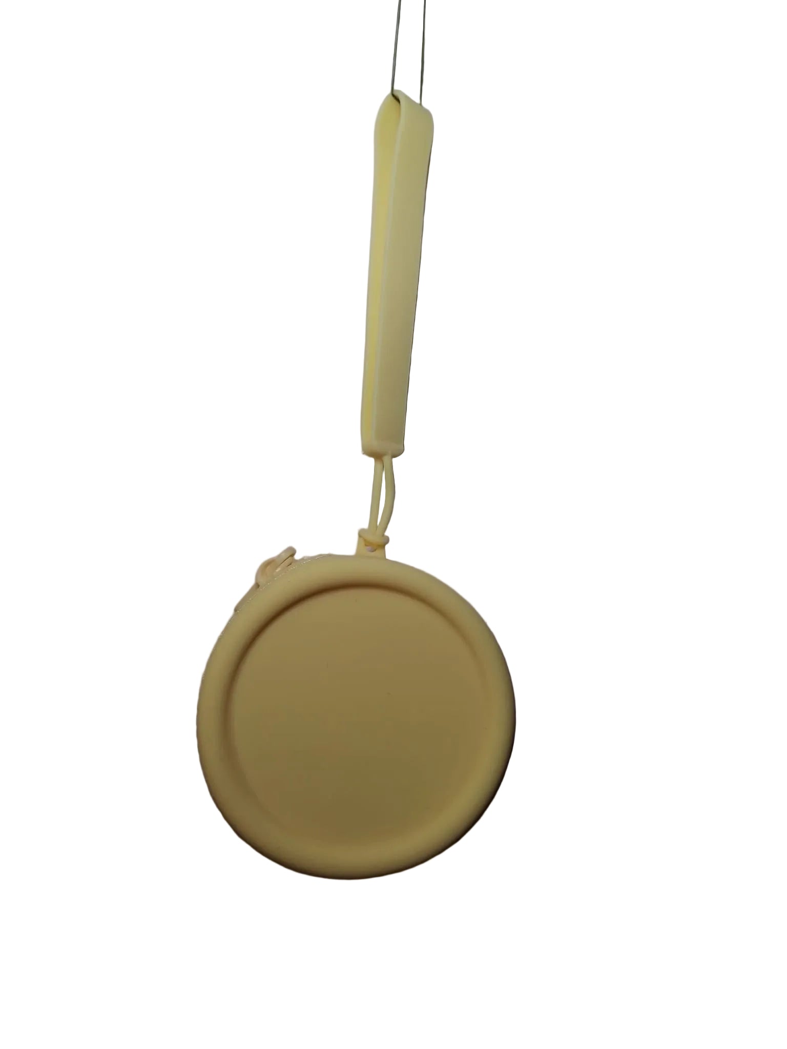 Yellow silicone lid with a handle on a white background