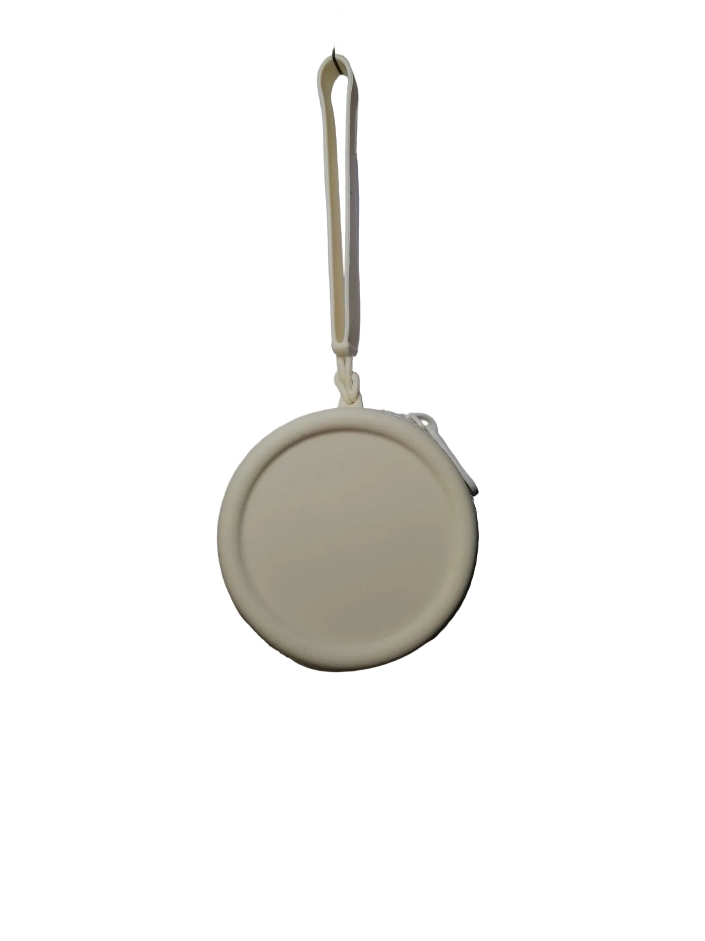 Round beige object with a string on a white background