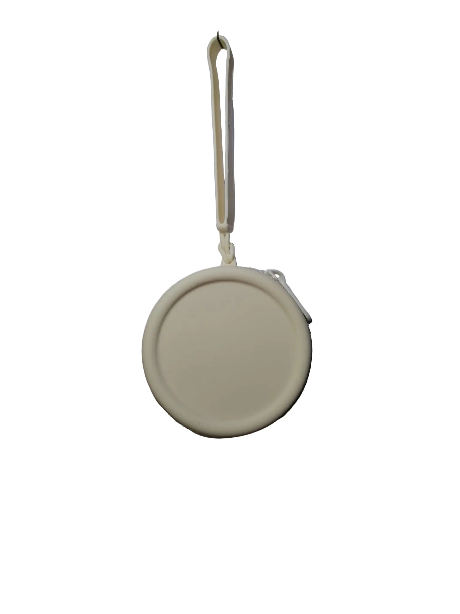 Round beige object with a string on a white background