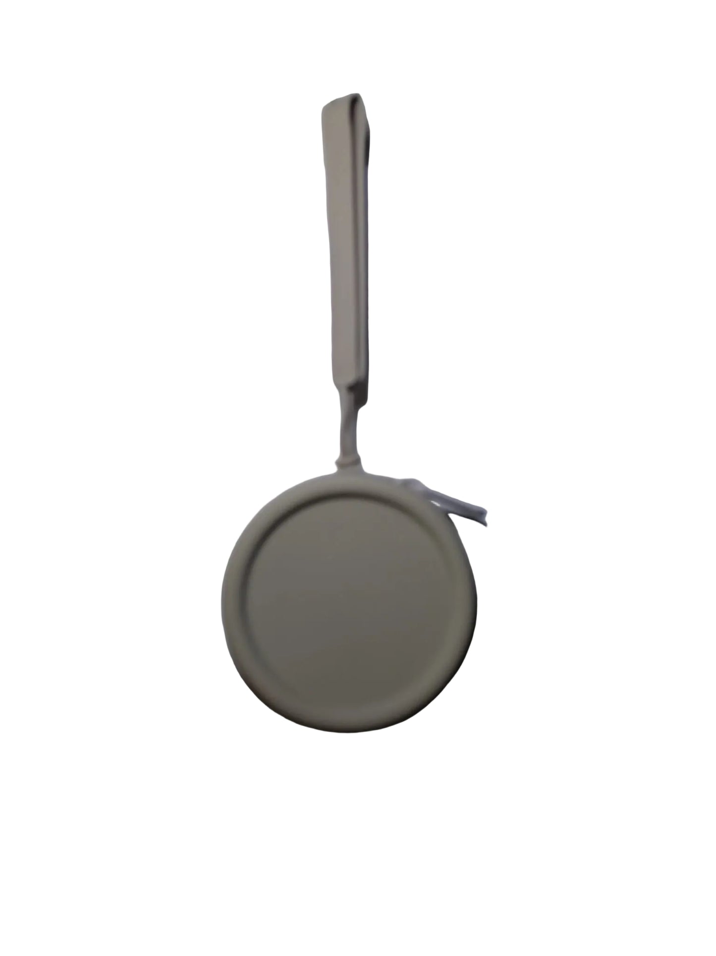 Round beige object with a string on a white background