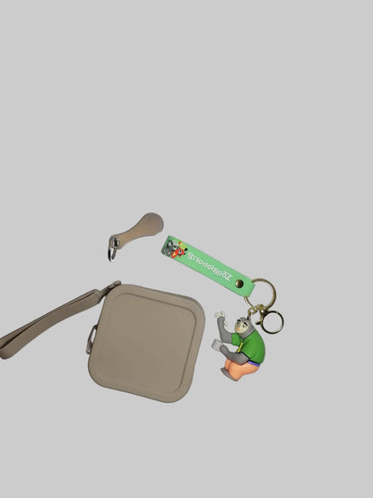 Beige pouch with a keychain featuring a cartoon character on a white background