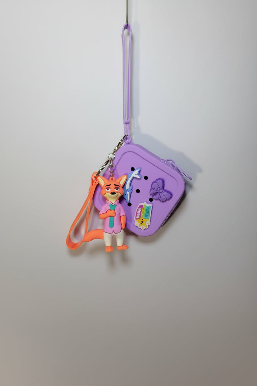 Purple pouch with a cartoon character keychain on a textured white background
